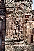 Banteay Srei temple - sculpted devata represented in a shrine, geese decorate the shrine